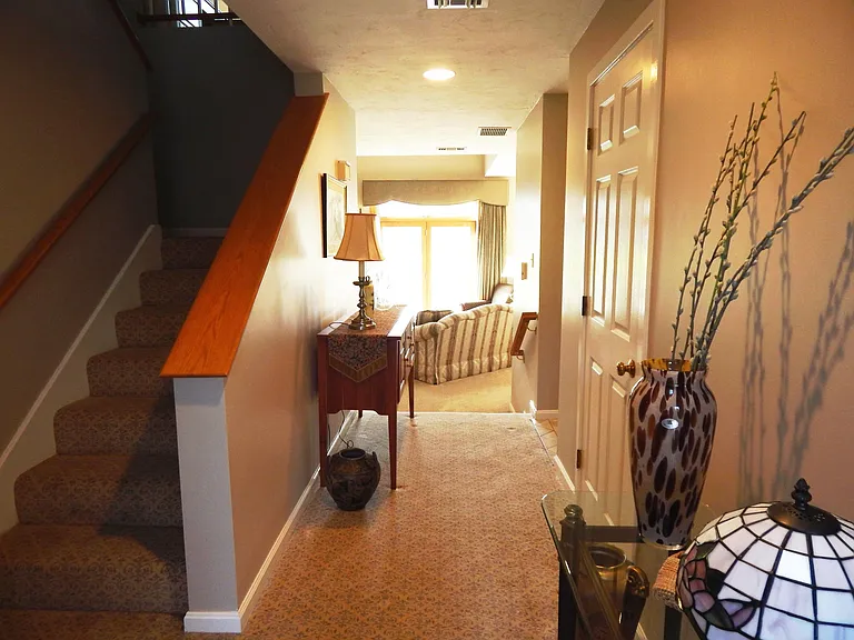 Entrance hall to living room, kitchen, dining room, split stairway to 2nd floor loft & bedrooms