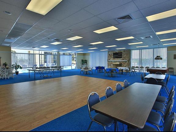 clubhouse with ping-pong table, library, and workout room.