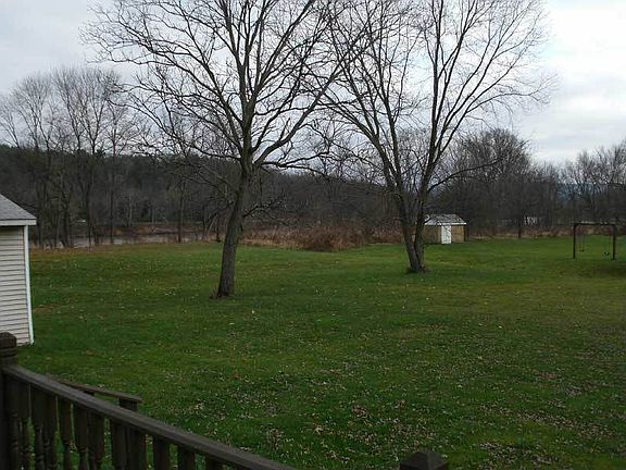 View of the Susquehanna River and the mower shed from the porch