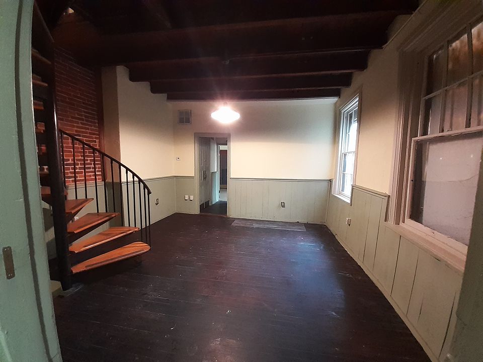 Living room and spiral staircase to second floor