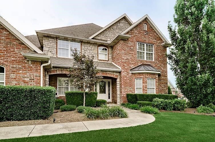 Beautiful Stone/Brick combination - Covered, Arched Front Porch has a welcoming appeal...
