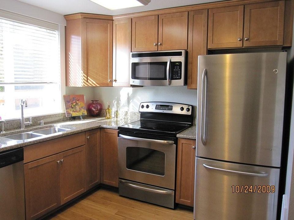 Kitchen: Granite Slab counters, stainless steel sink