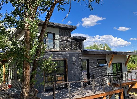 Side decks, kitchen door on main and view of upstairs door and deck. Before outdoor furniture was installed.