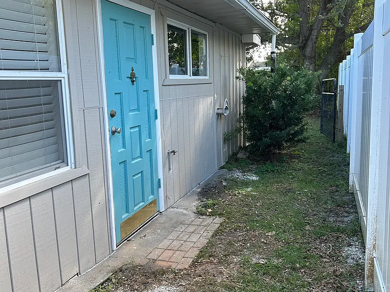 Side entrance makes an excellent office entrance or separate quarters for sharing house.