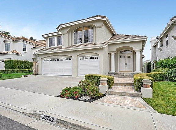 Welcome Home!  This Moulton Ranch home boasts natural light, soaring ceilings, and views