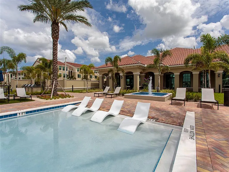 Resort-Inspired Beach Entry Pool with Sundeck.