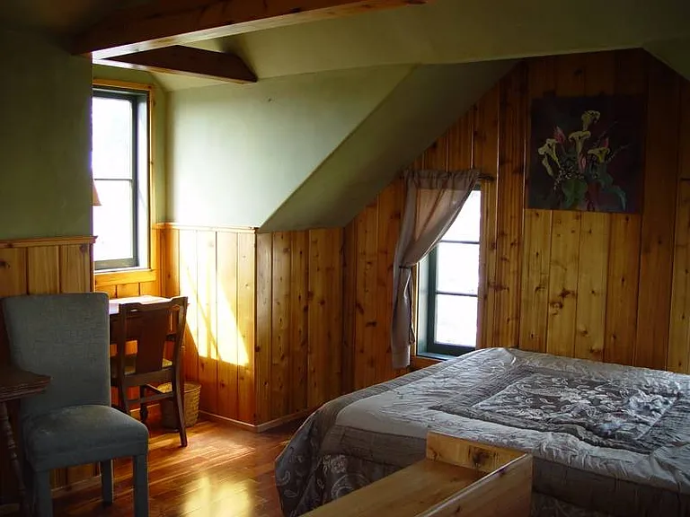 Attic bedroom. A top view with a queen bed.