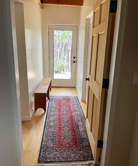 hallway leads to workshop/storage room and side yard