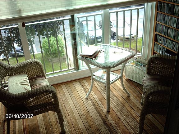 Fully Enclosed Balcony Makes a Great Sitting Room or Den Area!