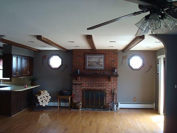 Fireplace off of kitchen 
