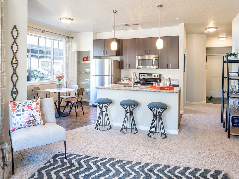 Wood-style plank flooring in entryway and kitchen