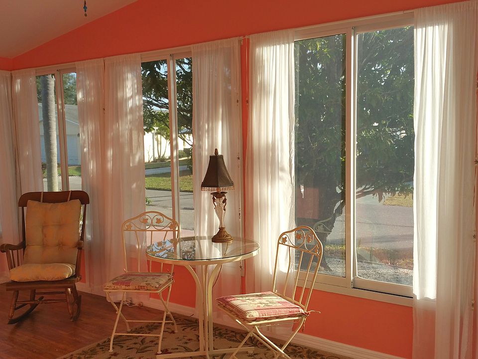 Bright coral Sunroom!