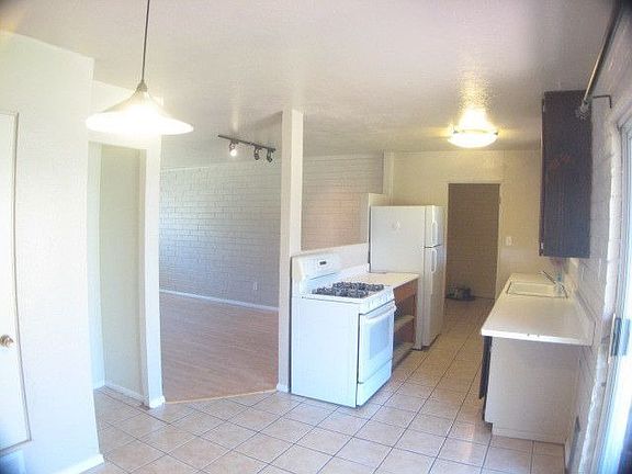 Updated kitchen with ceramic tile flooring