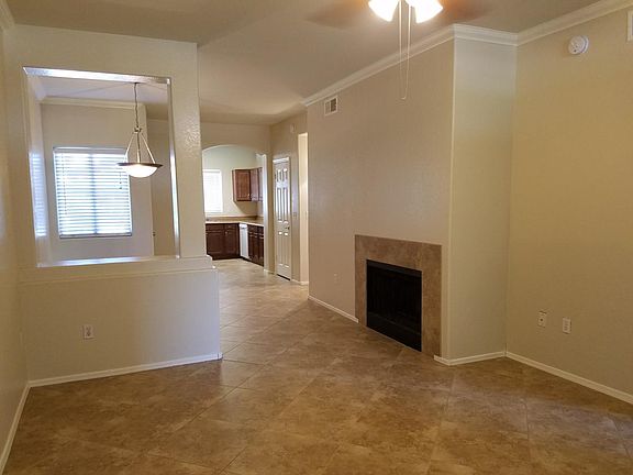 Living room to fireplace & kitchen
