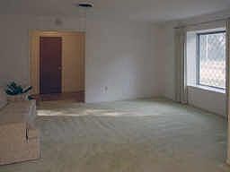 Living Area with view of Wide Foyer and Large Window