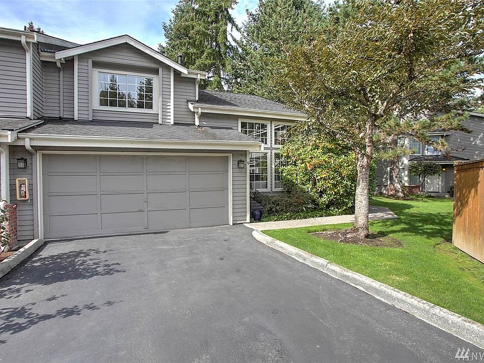 Welcome home to Riva Chase! This fantastic end-unit 3 bedroom, 3 bath townhome-style condo will delight you with it's soaring ceilings, walls of windows and spacious feel. The great floorplan provides a master suite on the main floor with ensuite bath, and two large bedrooms plus a loft on the upper floor. One of the upper bedrooms shares continental access to the bathroom and could function as a second master. The kitchen is a wonderful place to gather with a breakfast bar, ample space and a butler's pantry. Stay connected with your guests in the open-concept floor-plan, uniting the kitchen with the spacious and bright dining and living areas. A glass French door leads to the entertainment sized deck and secluded landscaped garden space. Upstairs you'll love the loft overlooking the main floor--perfect for a desk or lounge space. 