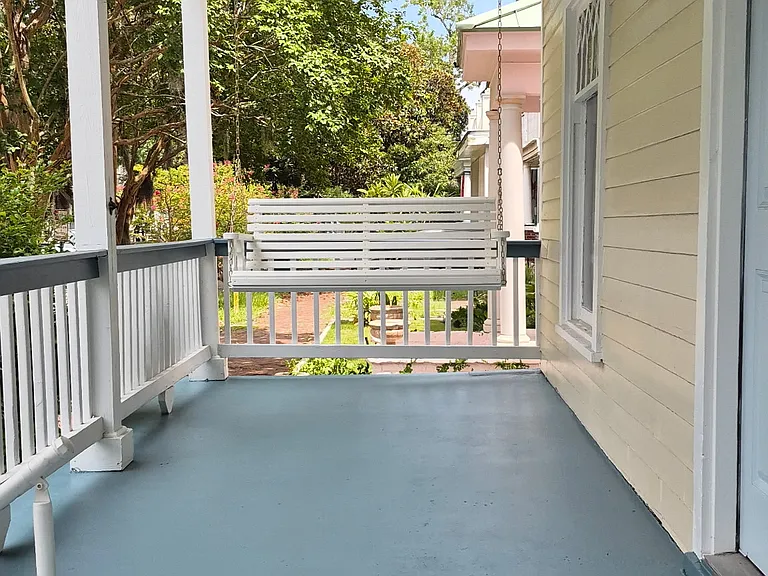 Downstairs porch has a brand new built-in porch swing. Will have new rocking chairs prior to moving in.