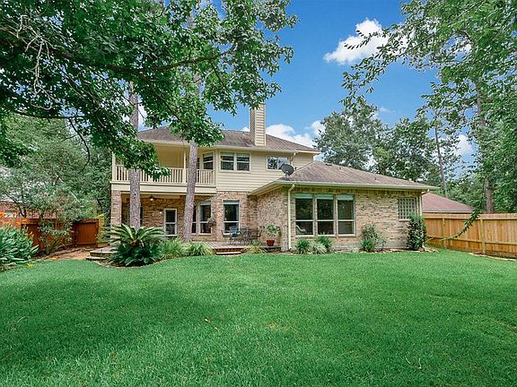 There's a large deck downstairs for entertaining, and plenty of yard space if the party overflows from the patio. From this shot, you can see the upstairs porch, that provided the pool vista, in a previous photo.