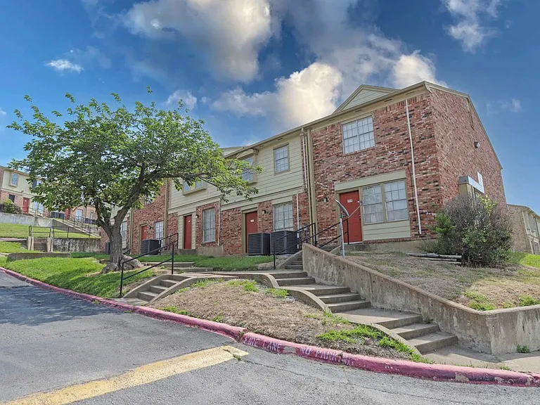 Bright, well-kept exteriors highlighting the townhome-style architecture.