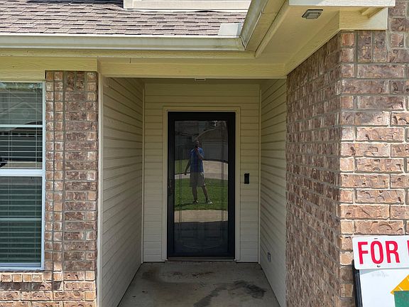Storm door and covered front entrance