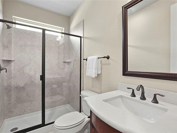 THERE'S A GENEROUS SIZED FULL BATH NEXT TO THE STUDY WHICH FEATURES A LINEN CLOSET AND QUARTZ COUNTERS.  DID YOU KNOW... A MURPHY BED COULD EASILY TRANSFORM THE STUDY INTO A 4TH BEDROOM!