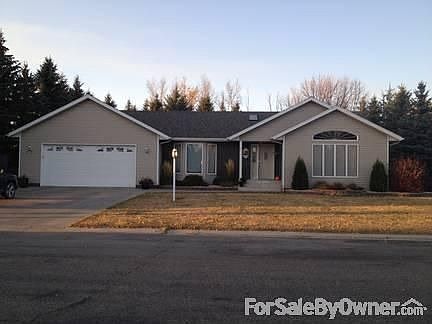 Front yard of ranch home
						:
						Includes landscaping with perennials on prime cul-de-sac lot