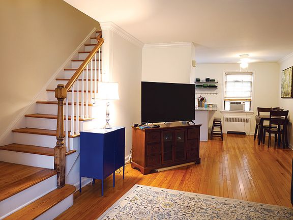 Beautiful hardwood flooring throughout ... stairs to 2 bedrooms and full bath.