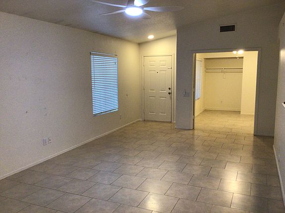 Looking back at the front door through the great room And second bedroom