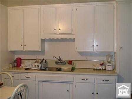 Cozy bright kitchen with direct access to enclosed patio