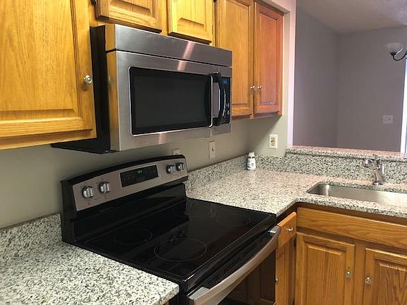 Granite counters. Cabinets have since been painted gray.