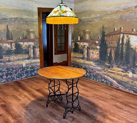 Another angle of dining room with all new luxury vinyl plank floors and mural with scene of landscape of the hills of Italy.