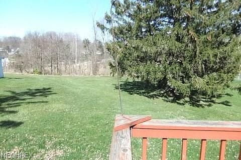 Rear deck off family room over looks the acreage.