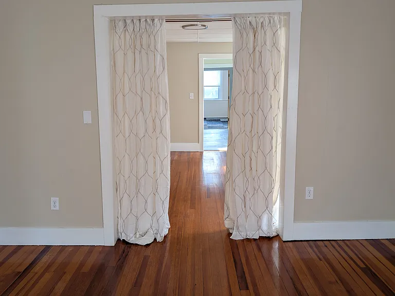 Living room (area number 2), could be a bedroom when curtains are closed