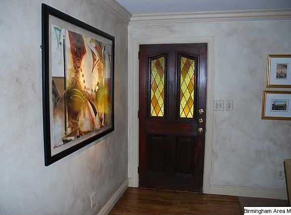 Foyer with gleaming hardwoods