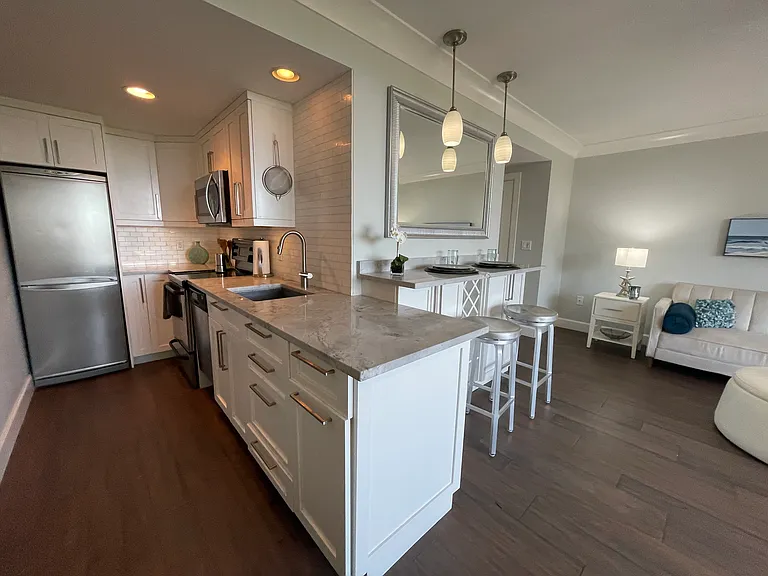 Marble kitchen counter provides ample work surface and storage below.