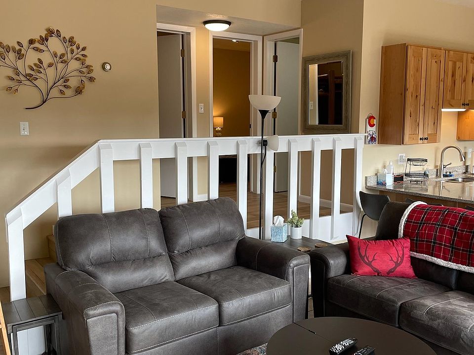 View of entry to two bedrooms and main bathroom .