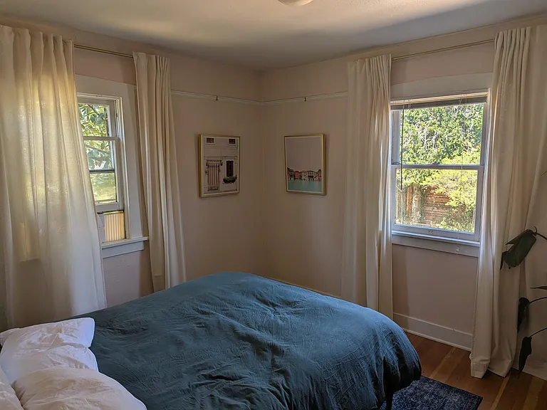 Second bedroom, tons of natural light during the day, and cool air can be brought in as neither has sun on it in the hot summers of portland.