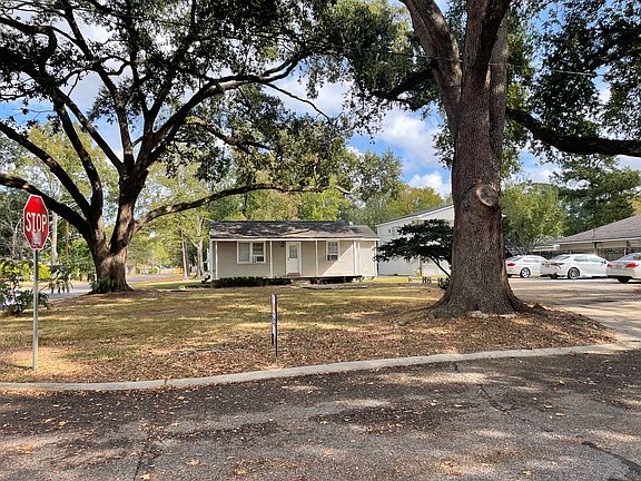 8509 Oliver front elevation on large tree shaded corner lot.
