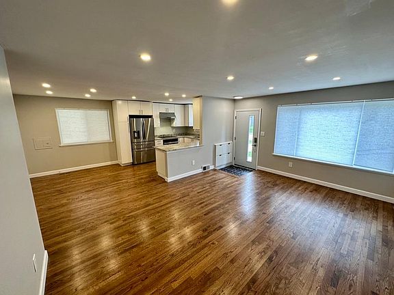 View from living room into dining and kitchen