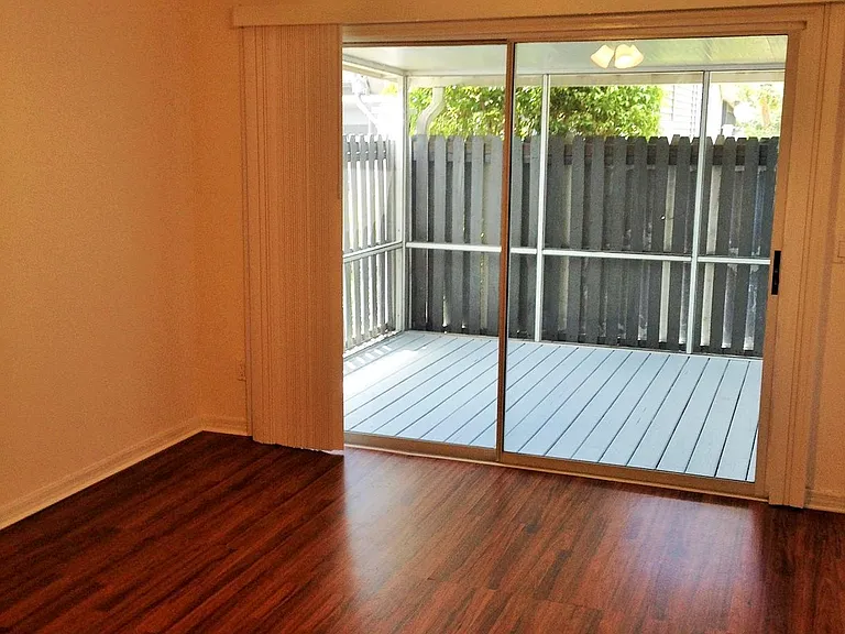 Downstairs primary bedroom overlooks lanai