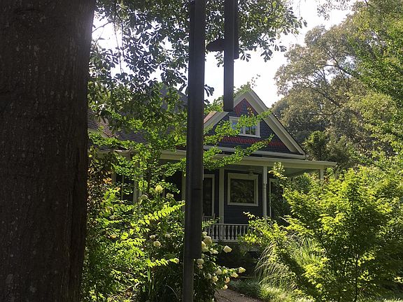 View from the street of the handmade tornado chime (they are way too heavy to work as a proper wind chime).