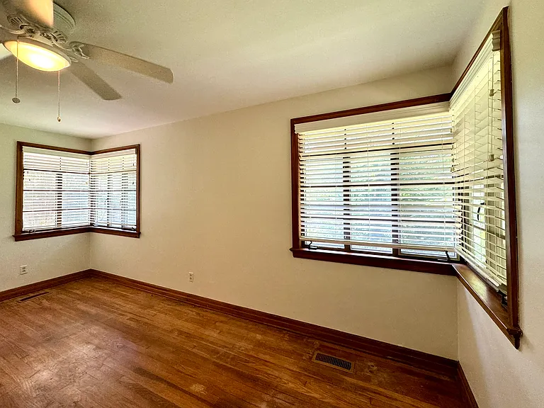 Bedroom 1 with special corner casement windows.