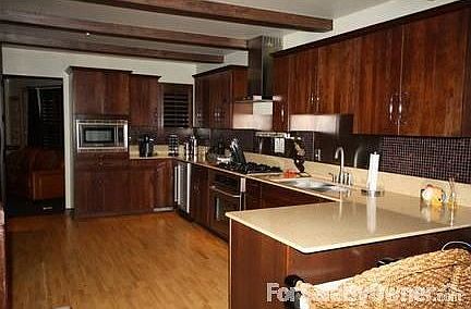 Large Kitchen
						:
						Kitchen Aid Cherry cabinets, Stainless appliances, Huge pantry.