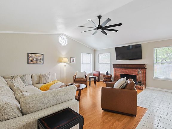 Unwind in a spacious, open-concept living room featuring plenty of comfortable seating meaning there is room for everyone to relax and make lasting memories together.