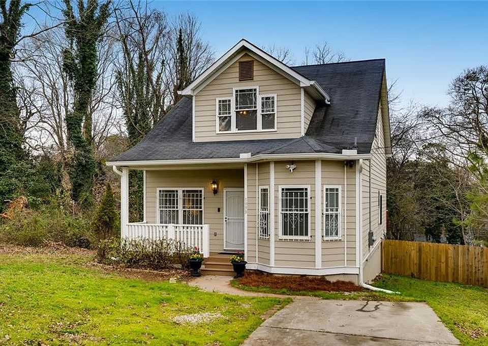 Front Yard with a porch and driveway.