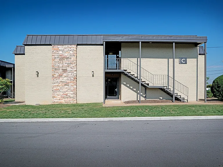 Experience contemporary living with this stylish apartment building, complete with unique architectural details.