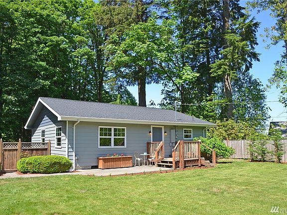 The front of the home has beautiful areas for flowers. Nice front patio.