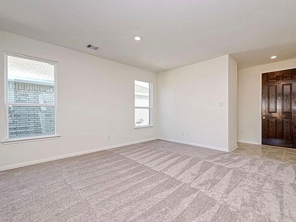 Bright dining area with plenty of room for family meals and gatherings.