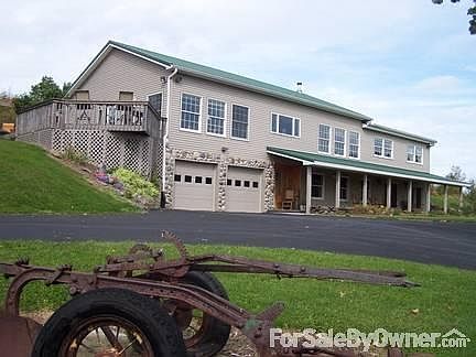 front of house w/ deck off master bedrm.