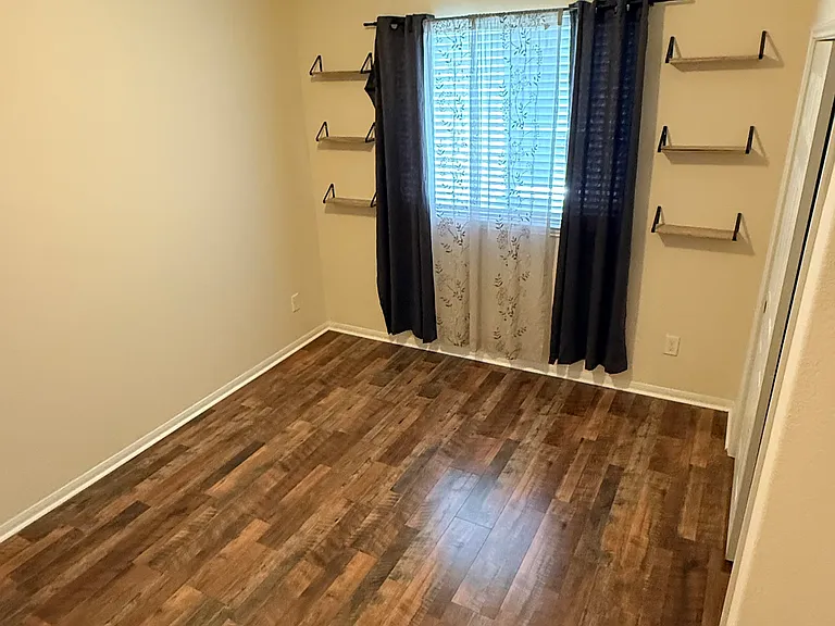 Each room is a nice size, has plenty of closet space and has new floors and paint. This is bedroom 3.